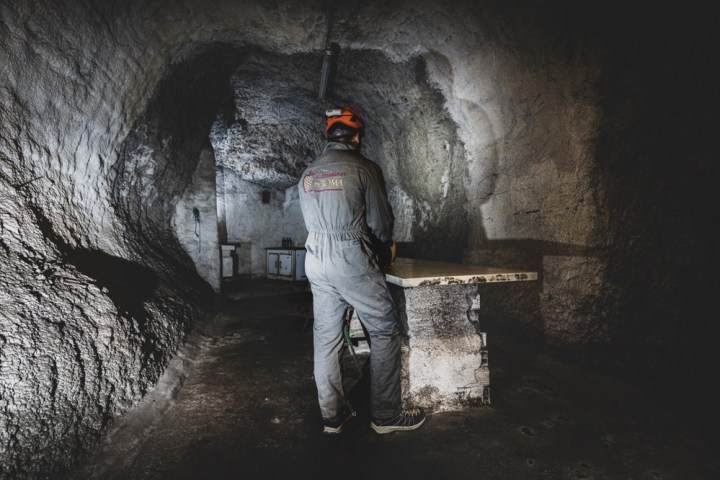 a man that is standing in the rain