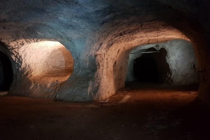 a man riding a skateboard down the side of a ramp