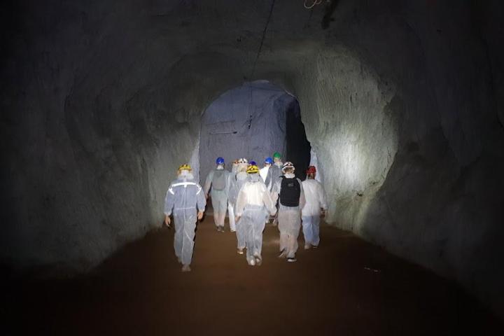 a man that is standing in the dark