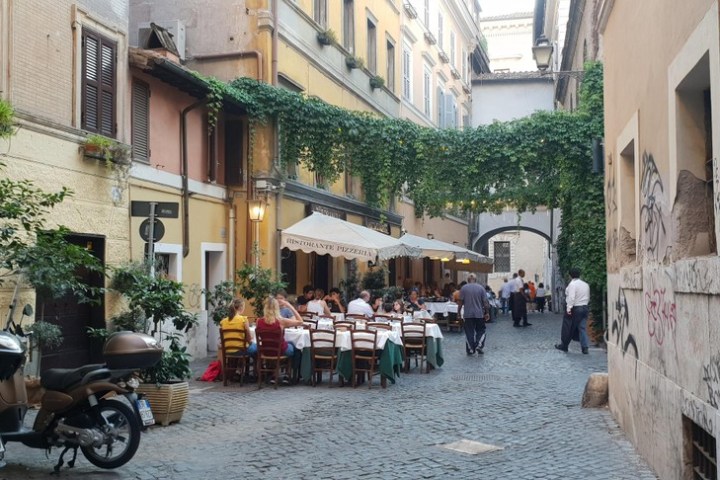a motorcycle parked on the side of a building
