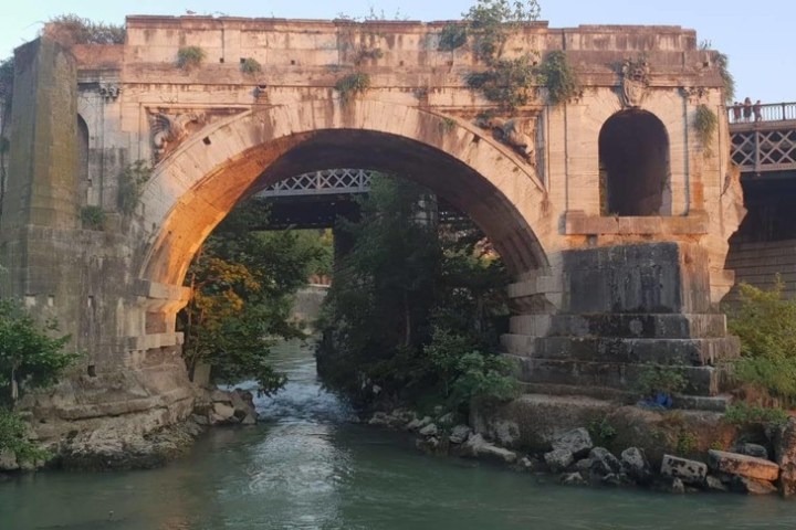 a train crossing a bridge over a river