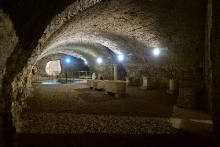 a view of a stone building that has a tunnel